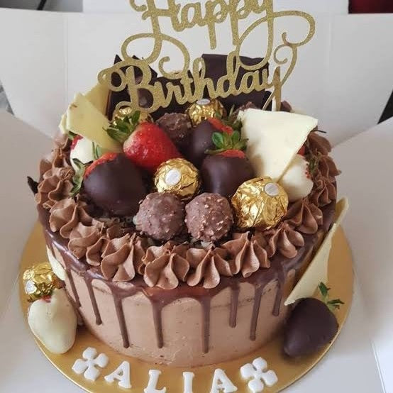𝐂𝐡𝐨𝐜𝐨𝐥𝐚𝐭𝐞 𝐑𝐨𝐜𝐡𝐞𝐫 𝐂𝐚𝐤𝐞 Our popular chocolate cake pimped  for the season with luscious dark chocolate ganache enrobed in almond rocher.  *𝑊… | Instagram